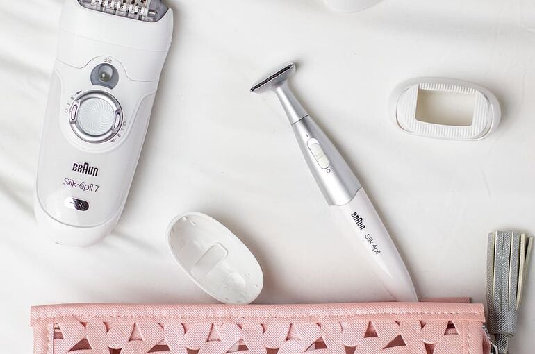 epilator-and-shaver-on-white-cloth